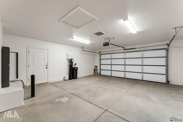 12616 E 49th Dr, Yuma, AZ 85367 - garage featuring a garage door opener and visible vents
