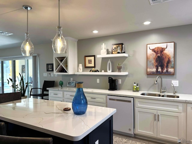 14442 E 54th St, Yuma, AZ 85367 - kitchen with white cabinets, a sink, dishwasher, a kitchen island, and visible vents