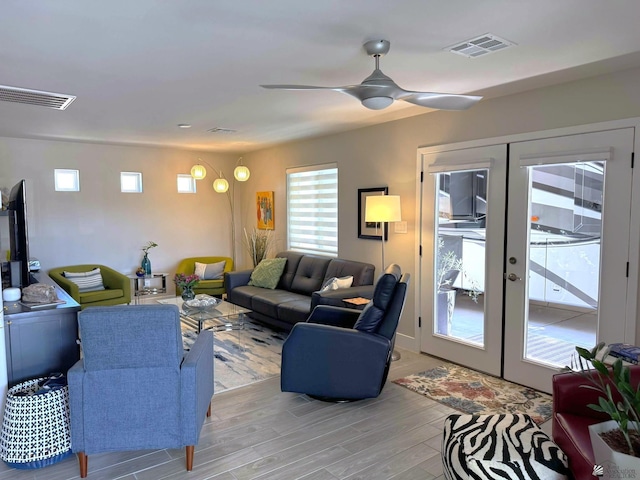 14442 E 54th St, Yuma, AZ 85367 - living room featuring visible vents, plenty of natural light, and french doors