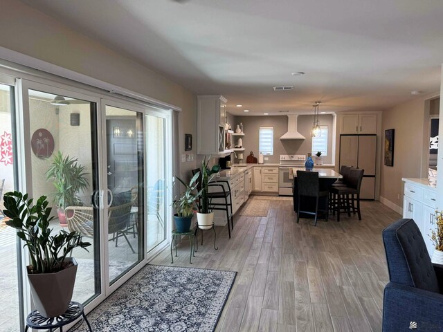 interior space featuring light wood-style floors and visible vents