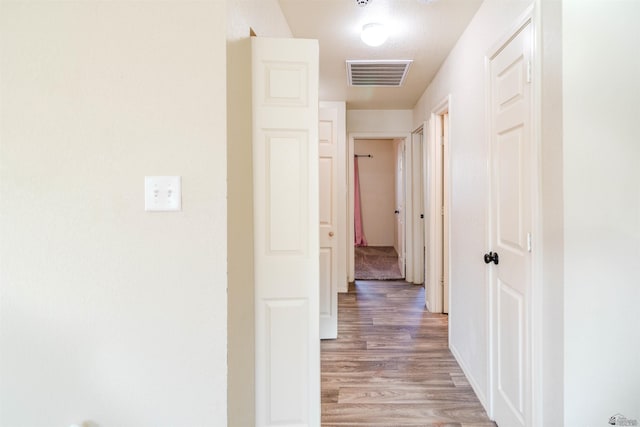 4780 W 11th Ln, Yuma, AZ 85364 - corridor with light wood-type flooring and baseboards
