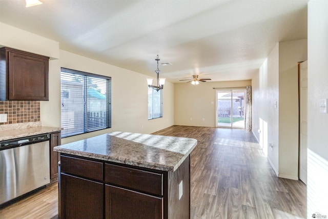 4780 W 11th Ln, Yuma, AZ 85364 - kitchen with stainless steel dishwasher, light wood-style floors, healthy amount of natural light, and dark brown cabinets