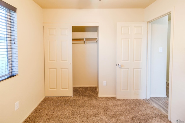 4780 W 11th Ln, Yuma, AZ 85364 - unfurnished bedroom featuring carpet flooring, a closet, and baseboards