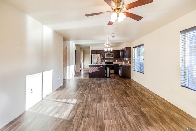 4780 W 11th Ln, Yuma, AZ 85364 - living area featuring dark wood finished floors, ceiling fan, and a chandelier