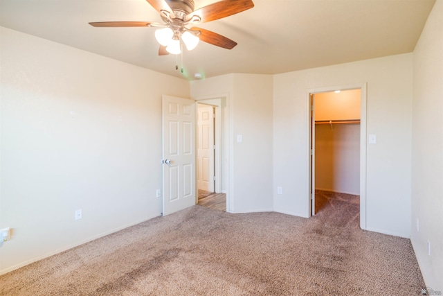 4780 W 11th Ln, Yuma, AZ 85364 - unfurnished bedroom featuring carpet flooring, a spacious closet, a ceiling fan, a closet, and baseboards