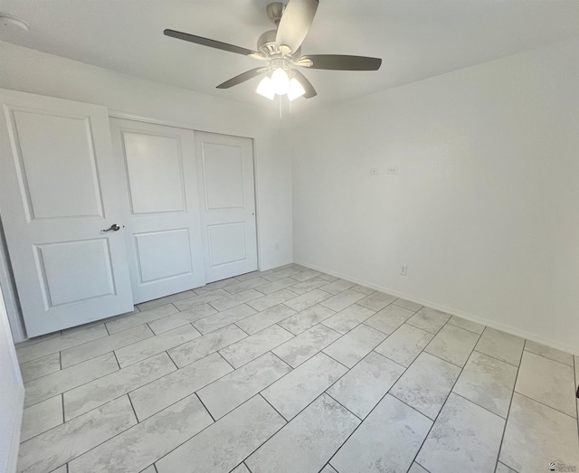 8756 E 41st St, Yuma, AZ 85365 - unfurnished bedroom with a closet and a ceiling fan