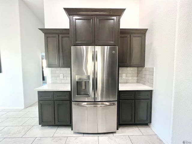 8756 E 41st St, Yuma, AZ 85365 - kitchen with stainless steel refrigerator with ice dispenser, decorative backsplash, light countertops, and baseboards