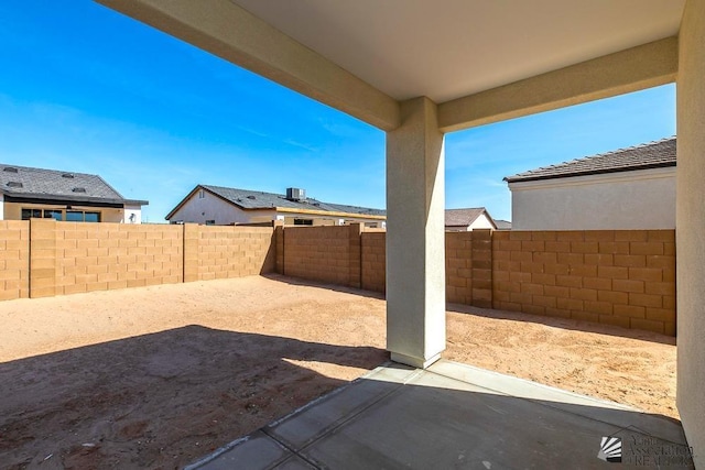 view of yard with a patio and a fenced backyard