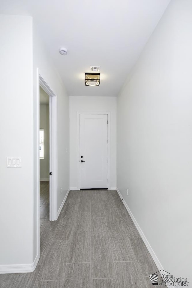interior space featuring baseboards