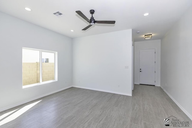 empty room with recessed lighting, ceiling fan, visible vents, and baseboards