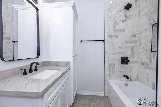 full bathroom featuring vanity and baseboards