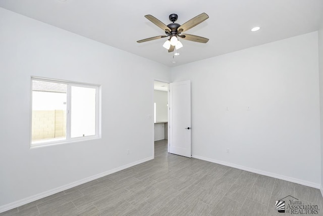 empty room with baseboards, recessed lighting, and ceiling fan
