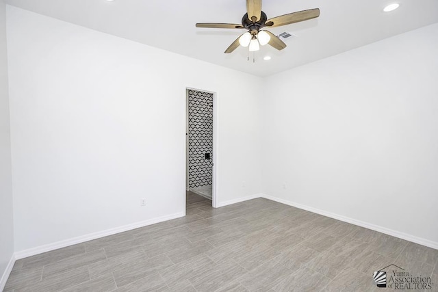 unfurnished room with recessed lighting, ceiling fan, visible vents, and baseboards