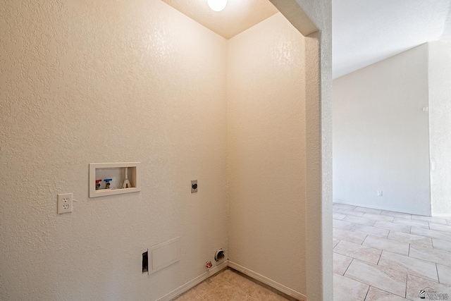 laundry room featuring gas dryer hookup, light tile patterned flooring, hookup for a washing machine, and electric dryer hookup