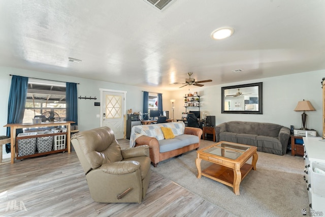 14419 E Fortuna Palms Pl, Yuma, AZ 85367 - living area with light wood-type flooring, ceiling fan, and visible vents