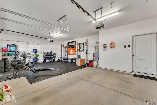 garage with a garage door opener and gas water heater