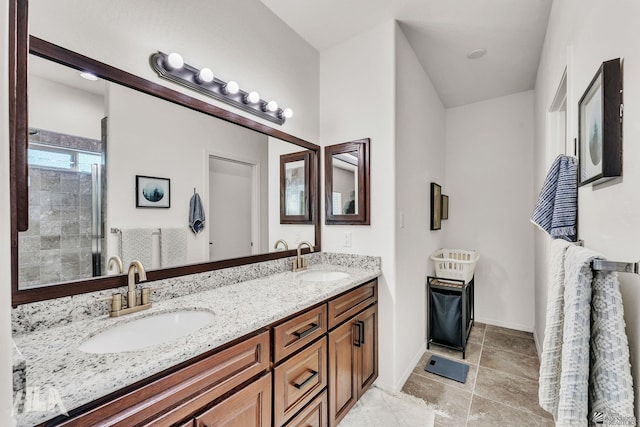 bathroom with vanity and a shower with door