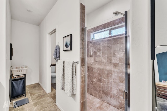 bathroom with an enclosed shower and toilet