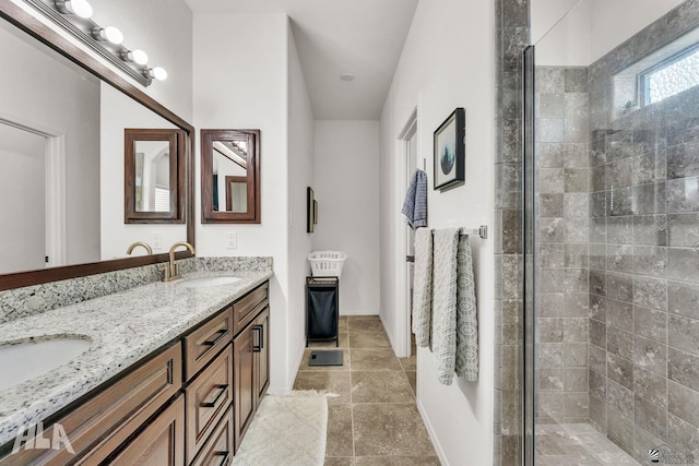 bathroom featuring vanity and a shower with door