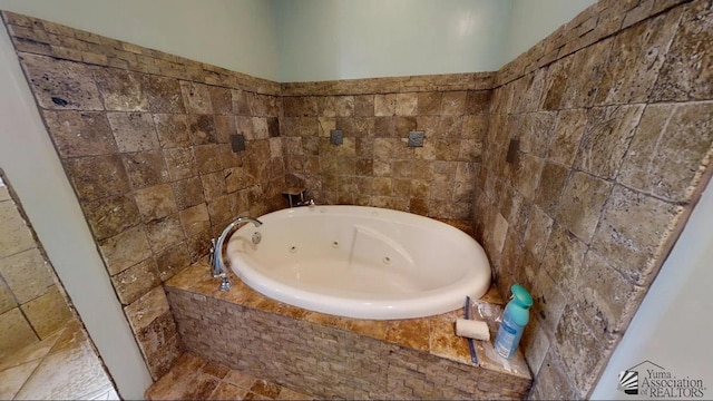 bathroom featuring a whirlpool tub