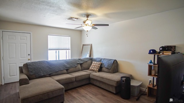 1700 S Crowder Ave Unit # 27, Yuma, AZ 85364 - living area with baseboards, ceiling fan, wood finished floors, and visible vents
