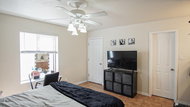 1700 S Crowder Ave Unit # 27, Yuma, AZ 85364 - bedroom with baseboards, ceiling fan, and light tile patterned floors