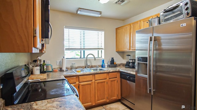 1700 S Crowder Ave Unit # 27, Yuma, AZ 85364 - kitchen with appliances with stainless steel finishes, a sink, light countertops, light tile patterned floors, and visible vents
