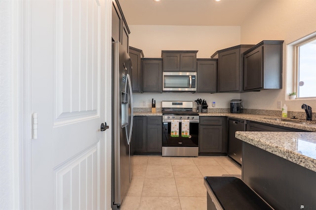 11602 E 33rd St, Yuma, AZ 85367 - kitchen featuring light tile patterned flooring, light stone countertops, a sink, stainless steel appliances, and recessed lighting