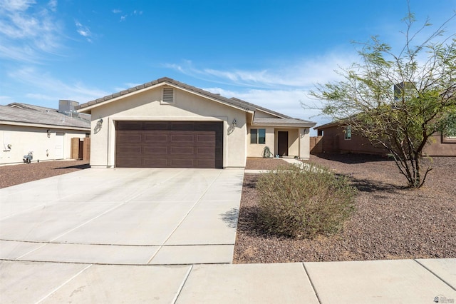 11602 E 33rd St, Yuma, AZ 85367 - ranch-style house featuring concrete driveway, stucco siding, and a garage