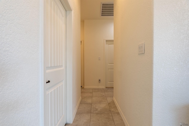 11602 E 33rd St, Yuma, AZ 85367 - hall with visible vents, baseboards, a textured wall, and light tile patterned floors
