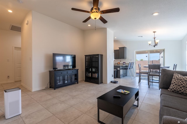 11602 E 33rd St, Yuma, AZ 85367 - living room featuring visible vents, ceiling fan with notable chandelier, and light tile patterned floors