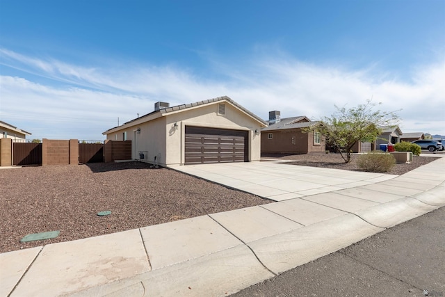 11602 E 33rd St, Yuma, AZ 85367 - single story home featuring fence, stucco siding, a gate, an attached garage, and driveway