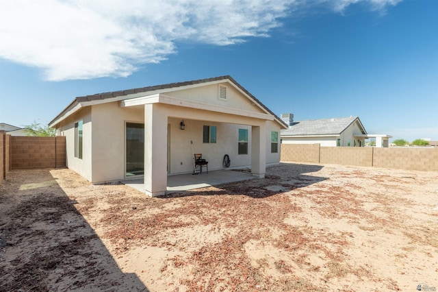11602 E 33rd St, Yuma, AZ 85367 - rear view of house featuring a fenced backyard, a patio area, and stucco siding