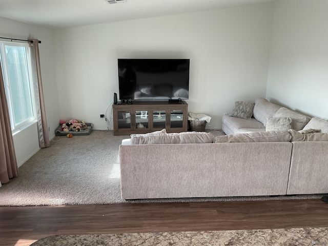living room with visible vents and wood finished floors