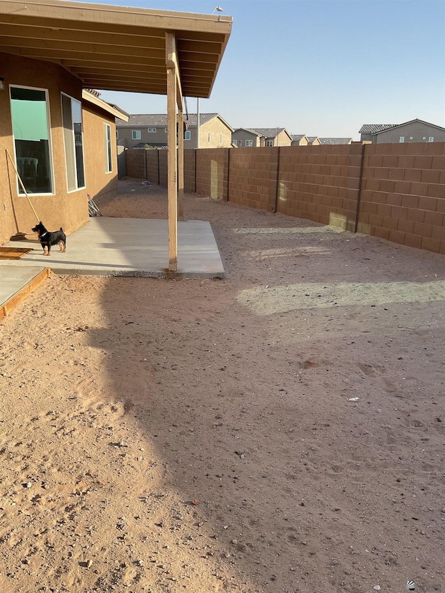view of yard with a fenced backyard and a patio area