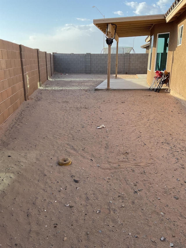 view of yard with a fenced backyard and a patio area