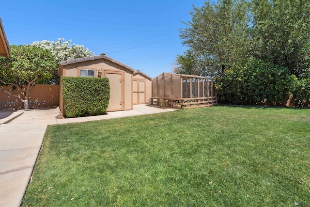 1215 S 41st Dr, Yuma, AZ 85364 - view of yard featuring a storage unit and an outbuilding