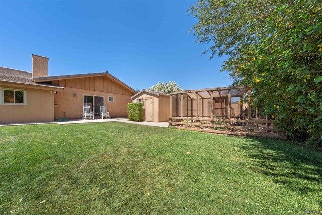 1215 S 41st Dr, Yuma, AZ 85364 - view of yard with a storage shed, an outdoor structure, and a patio