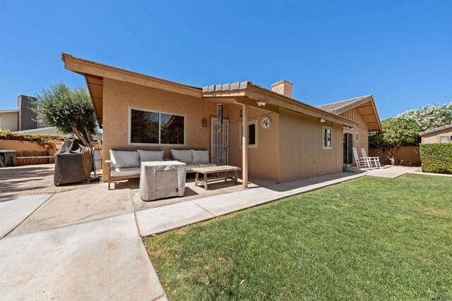 1215 S 41st Dr, Yuma, AZ 85364 - rear view of property featuring an outdoor hangout area, a chimney, and a patio