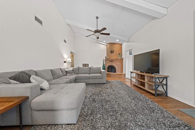 1215 S 41st Dr, Yuma, AZ 85364 - living area with wood finished floors, ceiling fan, beam ceiling, a fireplace, and high vaulted ceiling