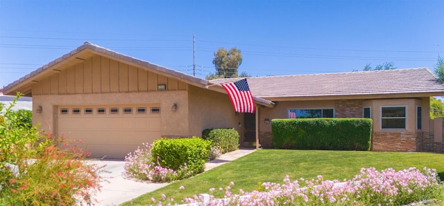 1215 S 41st Dr, Yuma, AZ 85364 - single story home featuring an attached garage, driveway, a front yard, and stucco siding