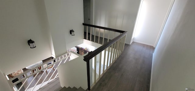staircase with wood finished floors