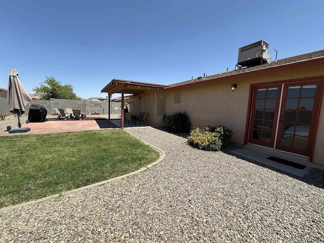 11228 E 25th St, Yuma, AZ 85367 - view of yard featuring a patio area and central air condition unit