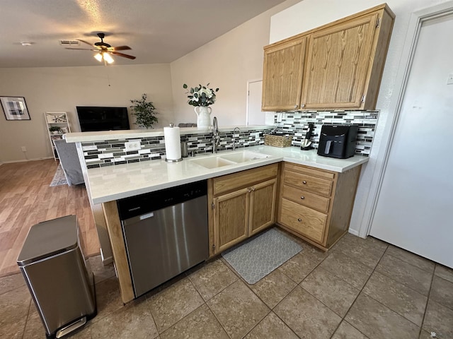 11228 E 25th St, Yuma, AZ 85367 - kitchen featuring dishwasher, a sink, a peninsula, decorative backsplash, and a ceiling fan