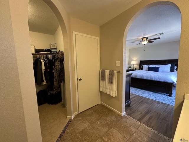 11228 E 25th St, Yuma, AZ 85367 - bathroom featuring a ceiling fan, baseboards, and a textured ceiling