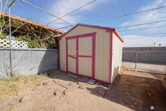 view of shed with a fenced backyard