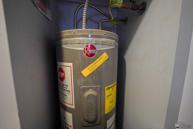 utility room featuring electric water heater