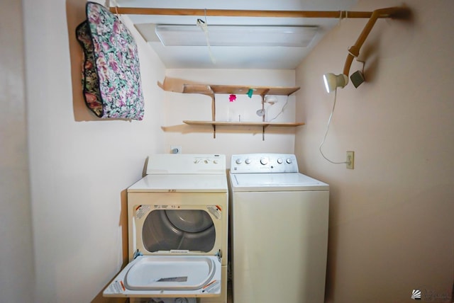 laundry area featuring laundry area and washer and clothes dryer