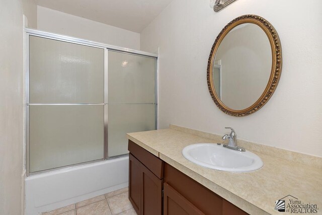 2413 W 13th Pl, Yuma, AZ 85364 - full bath featuring vanity, tile patterned floors, and enclosed tub / shower combo