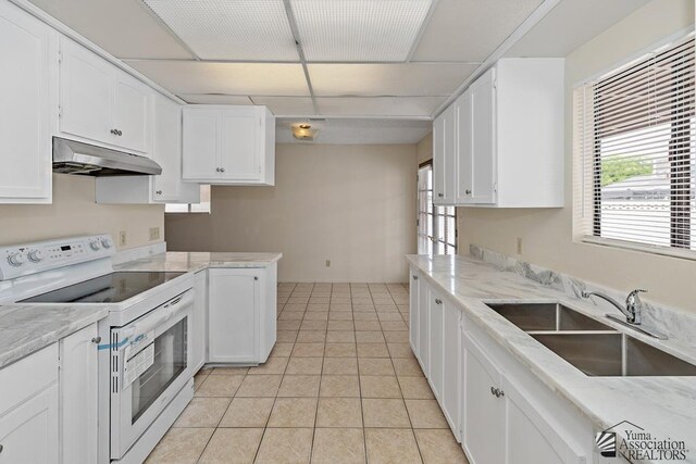 2413 W 13th Pl, Yuma, AZ 85364 - kitchen featuring white electric stove, under cabinet range hood, a sink, white cabinetry, and light stone counters